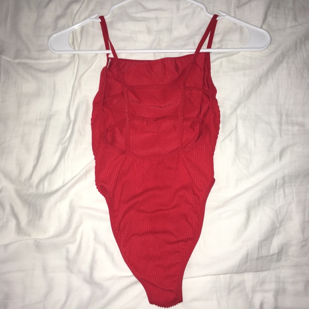 Red cage-back bodysuit